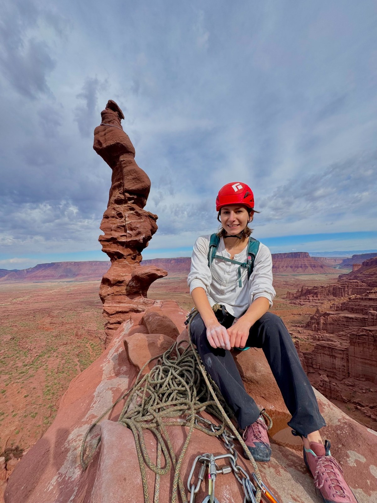 Amanda climbing among desert rock towers